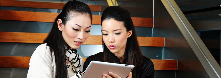 two ladies with a tablet